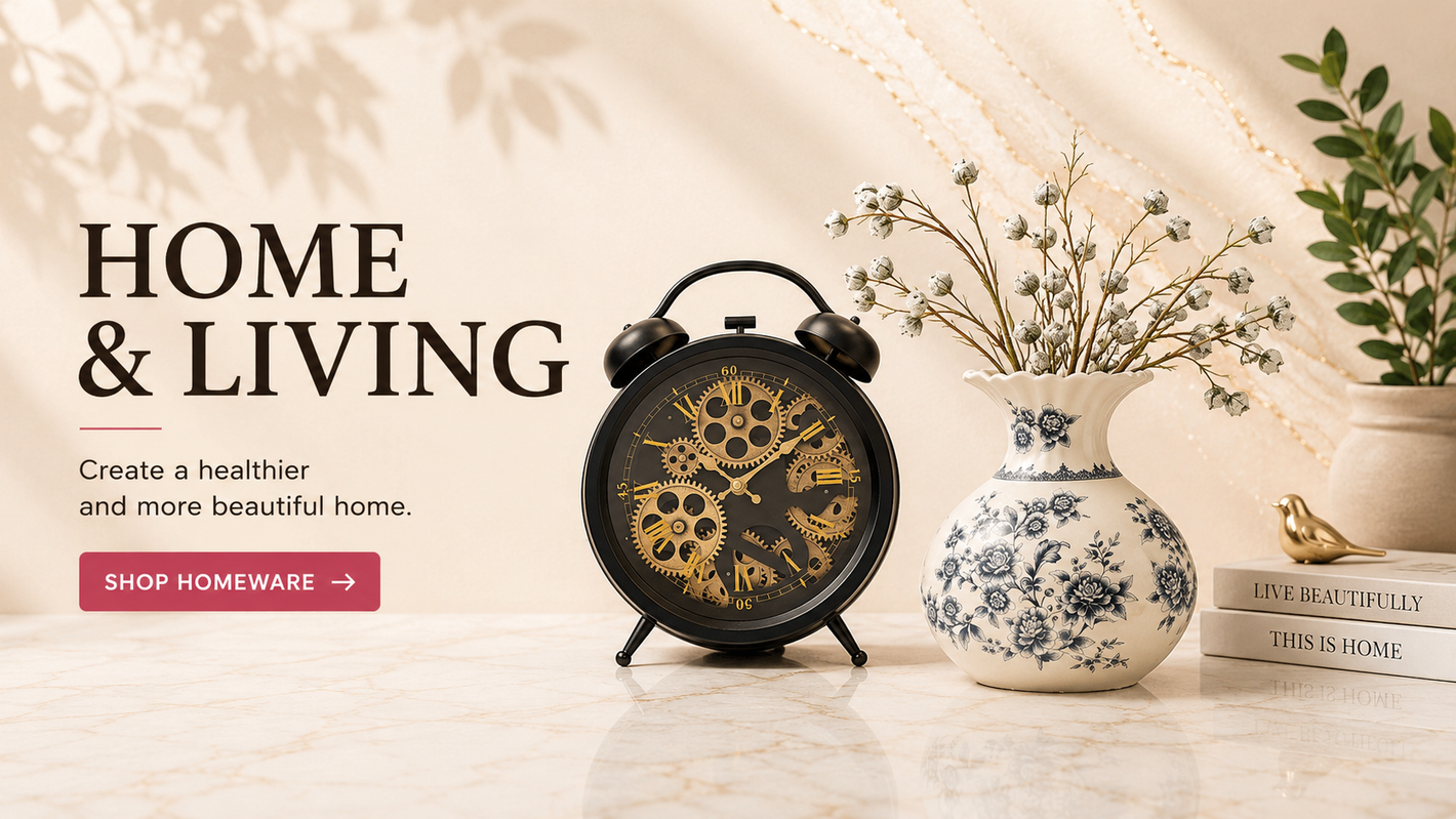 Elegant home décor featuring a vintage clock, decorative ceramic vase and home accessories on a warm marble surface.